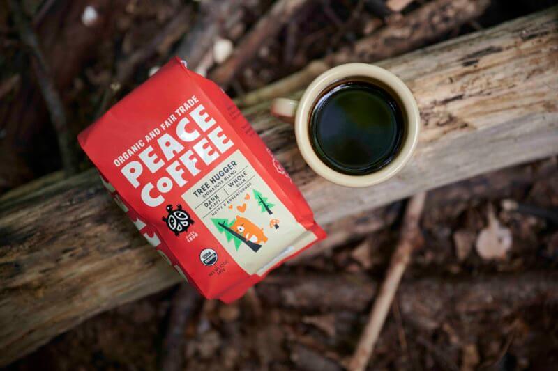 a bag of organic dark roast coffee in the woods