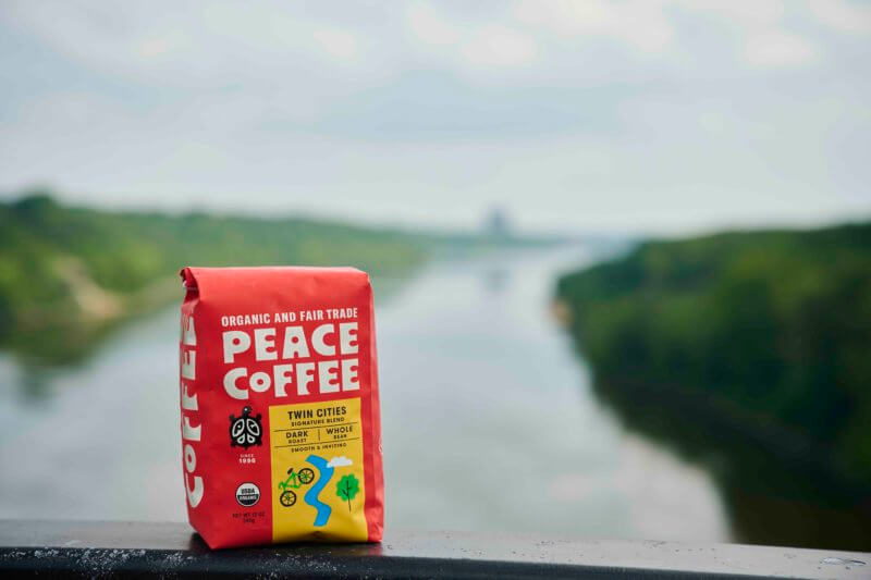 a bag of fair trade dark roast coffee by the river