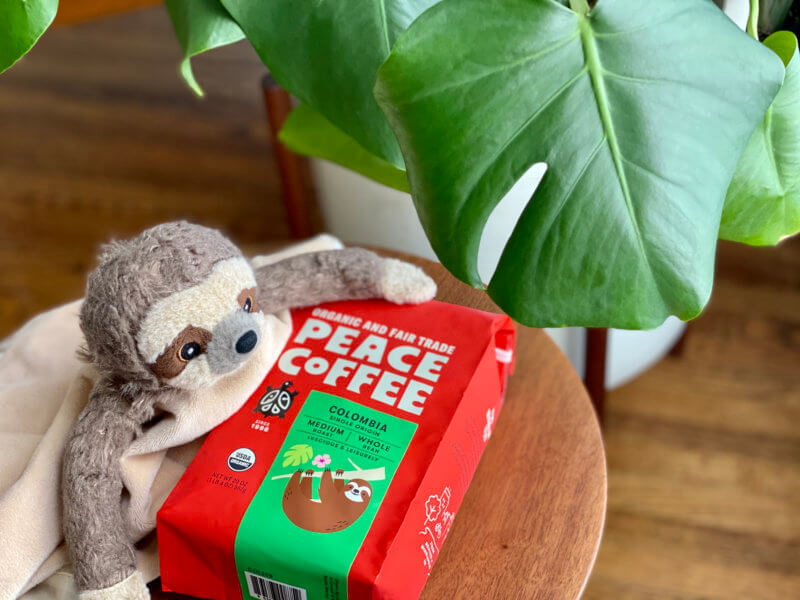 bag of Colombia Single Origin with a furry sloth