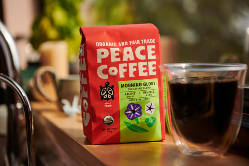 fair trade light roast coffee with a mug of brewed coffee
